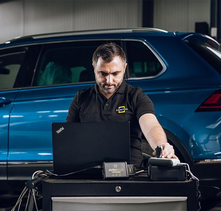 Specialist scanning a car with AVDI plus software